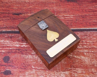May include: A wooden box with a brass latch and a gold spade design on the lid. The box has a brass plaque with the text "Happy Birthday Dad".