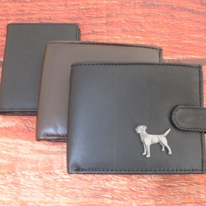 May include: Three leather wallets in black, brown, and dark brown with a silver metal dog silhouette on the front of the black wallet.