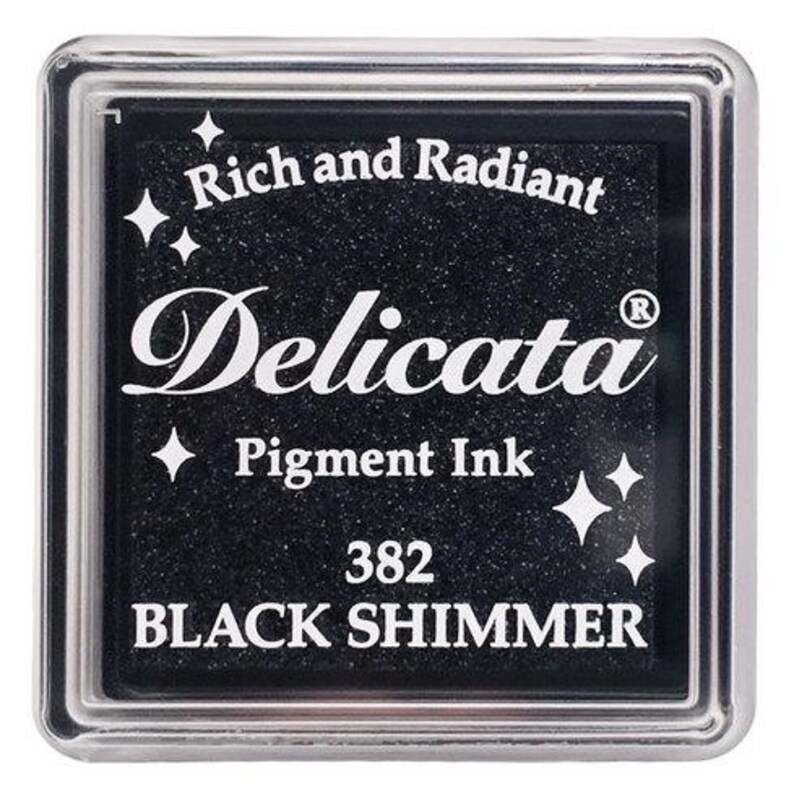 May include: Black ink pad with silver trim, labeled "Delicata Pigment Ink 382 BLACK SHIMMER" and "Rich and Radiant".