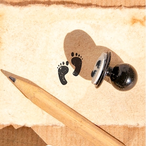 Cute Baby's Footprints Rubber Mini Stamp: Capture precious memories with this adorable mini stamp.