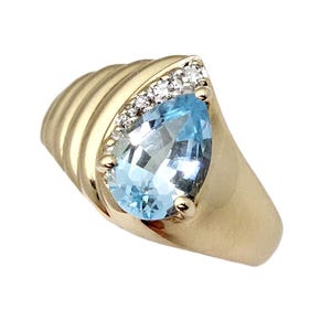 Stunning Sky Blue Topaz Ring in 14K Gold with 4 Diamonds - Size 4