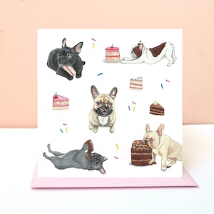 May include: A square greeting card featuring a white background with illustrations of French bulldogs in various colors, including black, fawn, and white with brown patches, interacting with colorful slices of cake and scattered sprinkles.