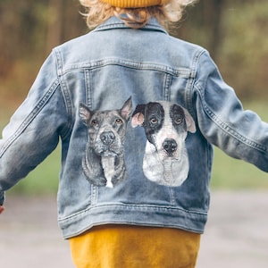 May include: A denim jacket with two embroidered dog portraits on the back. The dogs are a black and white pit bull and a black and white terrier.
