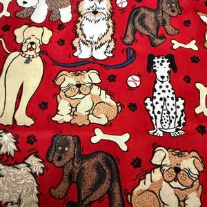 May include: A red fabric featuring a repeating pattern of various dog breeds, including a dalmatian, bulldogs, and shaggy dogs, interspersed with white bones, baseballs, and black paw prints. The dogs are depicted in different poses and colors.