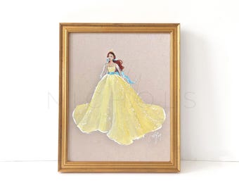 May include: A framed illustration of a woman in a yellow gown with a blue sash. The woman has red hair and is wearing a crown. The background is a light brown.