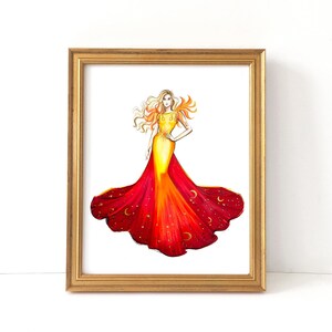 May include: A framed watercolor print of a woman in a flowing gown. The dress transitions from yellow to red, adorned with stars and crescent moons. The artwork is set in a gold frame, creating a striking visual.