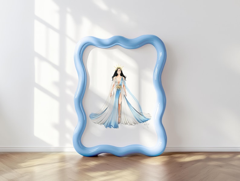 May include: A framed illustration of a figure wearing a flowing, floor-length gown with white and blue ombre panels, a deep V-neckline, and a gold starburst waist accent. The figure wears a gold crown. The frame is light blue with a wavy border.