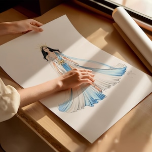 May include: A fashion illustration on white paper depicting a figure wearing a flowing, floor-length gown with a deep V-neckline, a gold sunburst headpiece, and a gold sun emblem at the waist, rendered in shades of white and blue watercolor.