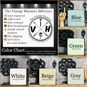 May include: Color chart for The Vintage Hammer wood signs and laser engraved wood art. The chart shows the different colors available for the signs, including blue, green, white, beige, and gray. Each color is displayed on a small wooden sign with a black metal stand.