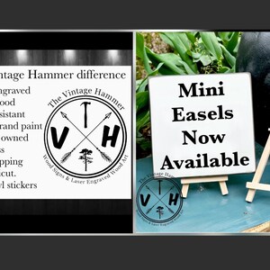 May include: A white sign with black text that reads "Mini Easels Now Available" is displayed on a small wooden easel. The sign is on a wooden surface with green plants in the background. The sign is surrounded by a black circle with the text "The Vintage Hammer Wood Signs & Laser Engraved Wood Art" and the letters "VH" inside the circle.