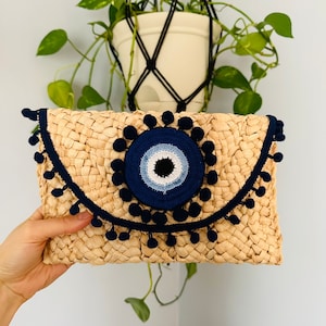 Evil eye Pom Pom straw clutch, evil eye bag, Greek eye bag, crochet eye bag, embellished eye bag