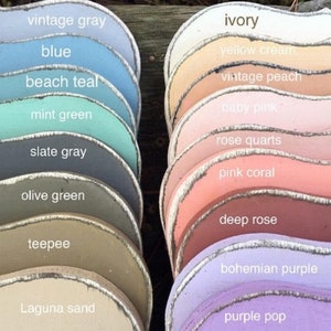May include: A color chart of 17 paint colors, arranged in two columns. The colors are named from top to bottom: vintage gray, blue, beach teal, mint green, slate gray, olive green, teepee, Laguna sand, ivory, yellow cream, vintage peach, baby pink, rose quarts, pink coral, deep rose, bohemian purple, and purple pop.