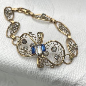 May include: A rustic wooden sign with the text "Welcome to our home" in white lettering. The sign features a distressed finish and a simple, inviting design, perfect for entryway decor.