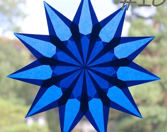 Estrella de ventana: Materiales e instrucciones para plegar una colorida luz para tu hogar. Tarjeta de regalo navideña.