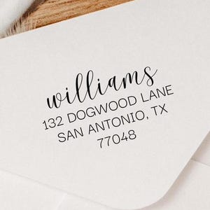 May include: White envelope with a black return address label that reads "williams 132 dogwood lane san antonio, tx 77048"