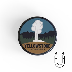 May include: A round magnet with a blue, brown, and white design featuring a geyser erupting in Yellowstone National Park. The text "Yellowstone National Park" is printed on the magnet.