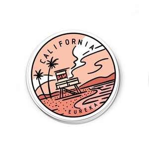 May include: A round sticker with a pink and white sunset scene. The sticker features a lifeguard tower on a beach with palm trees and the text "CALIFORNIA EUREKA".
