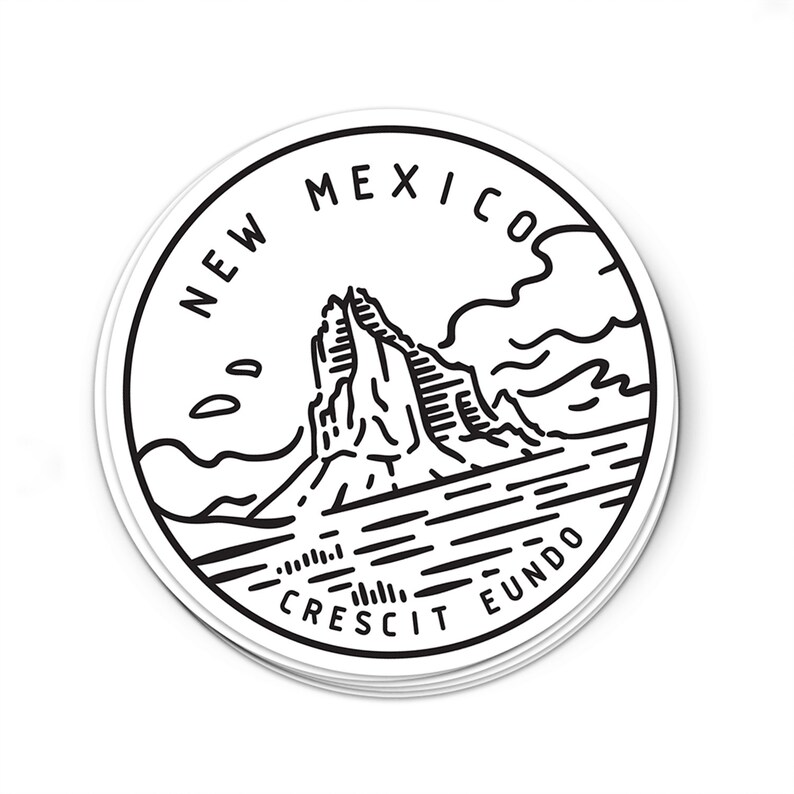 May include: Black and white illustration of a mountain range with the text "NEW MEXICO CRESCIT EUNDO" around the perimeter.