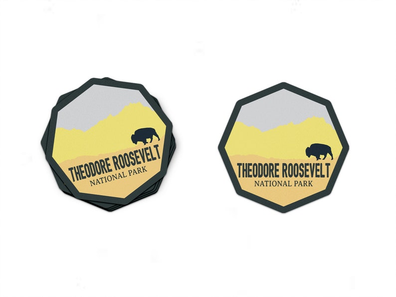 May include: A black and yellow sticker with a silhouette of a bison and the text "Theodore Roosevelt National Park".