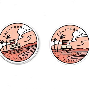 May include: Two round stickers with a California beach scene. The stickers feature a lifeguard tower, palm trees, and the words "California" and "Eureka".