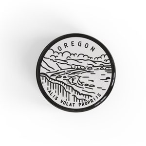 May include: Black and white illustration of a coastal landscape with the text "Oregon" and "Alis Volat Propriis" around the image.