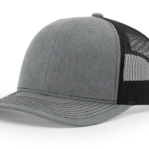May include: A gray and black trucker hat with a mesh back.