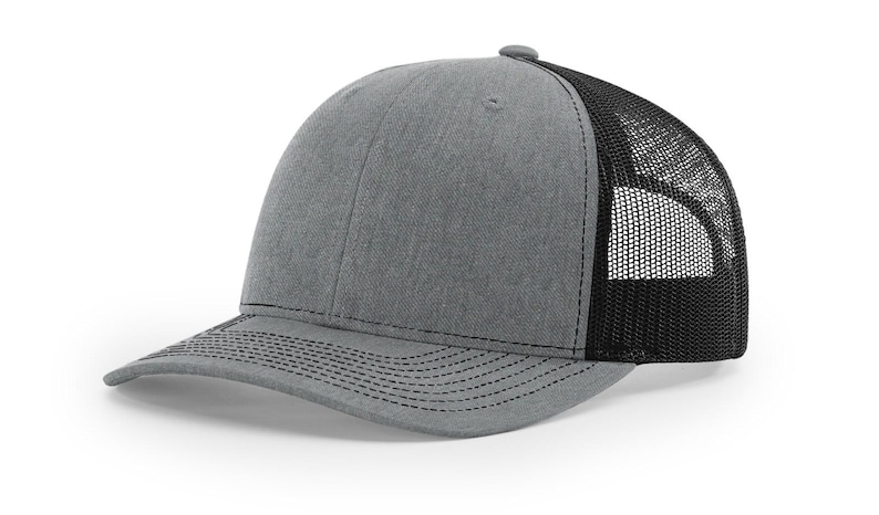 May include: A gray and black trucker hat with a mesh back.