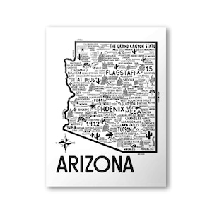 May include: A black and white map of Arizona with the state's name in large bold letters at the bottom. The map is filled with the names of cities, towns, and points of interest throughout the state. The Grand Canyon State is written at the top of the map.