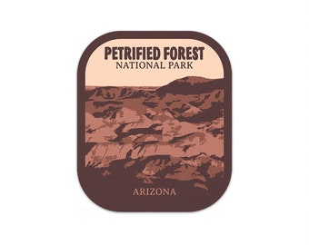May include: A brown and tan vintage-style patch with the text "Petrified Forest National Park" and "Arizona". The patch features a landscape image of a desert canyon.