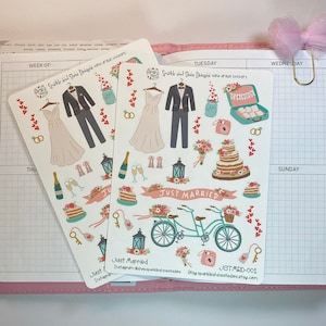 May include: A sheet of wedding-themed stickers featuring a bride and groom, a bicycle, a cake, flowers, and other wedding-related imagery. The stickers are printed on white paper and have a glossy finish. The text "Just Married" is printed on the sheet in a pink banner.