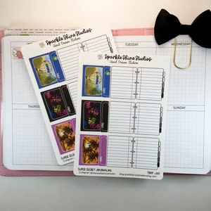 May include: A set of six hand-drawn stickers featuring colorful illustrations of a hot air balloon, a cityscape, and palm trees. The stickers are printed on white paper with black outlines and are labeled "Sparkle Shine Studios" and "Hand Drawn Stickers".
