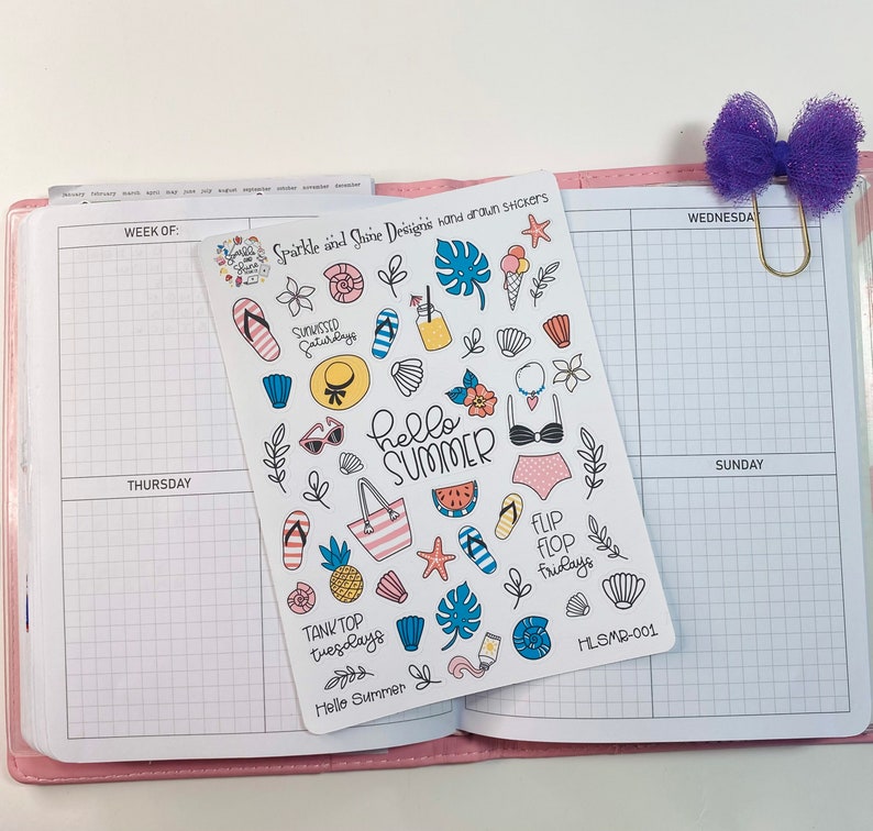 May include: A sheet of summer-themed stickers with illustrations of flip flops, seashells, pineapples, sunglasses, a watermelon slice, a swimsuit, and the text "Hello Summer".