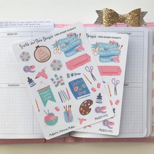 May include: Two sheets of stickers featuring illustrations of crafting supplies and the text "A Crafter's Work is Never Done". The stickers are on a pink planner with a gold bow.