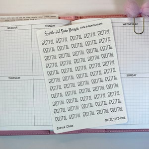May include: A white sticker sheet with the word "RECITAL" printed repeatedly in black, along with the text "Sparkle and Shine Designs hand drawn stickers" and "Dance Class". The sticker sheet is placed on an open planner.