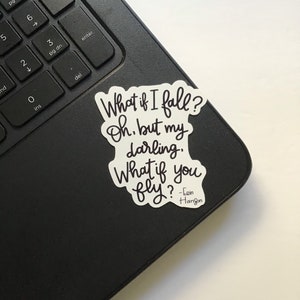 May include: A white sticker with black text that reads "What if I fall? Oh, but my darling. What if you fly? - Iain Hanson".