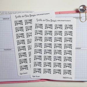May include: A sheet of stickers featuring a black and white illustration of spectacles and the text "Eye Exam". The stickers are on a white background and are arranged in rows.