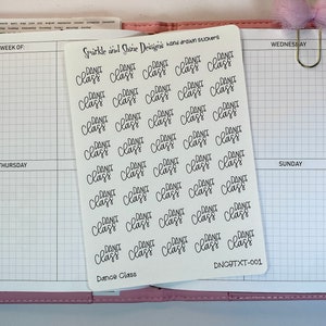 May include: A sheet of white sticker paper with 36 black and white stickers that say "Dance Class". The stickers are arranged in a grid pattern. The sheet is labeled "Sparkle and Shine Designs hand drawn stickers" and "Dance Class" at the bottom. The sheet also has the code "DNCOTXT-001" printed on it.