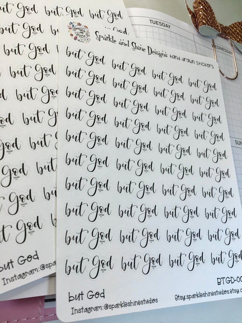 May include: A sheet of white sticker paper with multiple black and white stickers that say "But God". The stickers are arranged in rows and columns. The text "Sparkle and Shine Designs" and "Instagram: @sparkleshinestudios" is printed on the sheet.