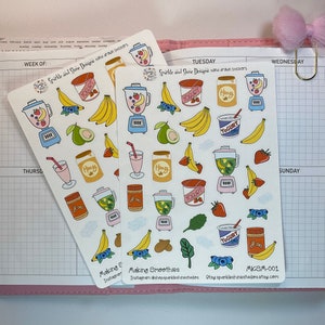 May include: Three sheets of stickers featuring hand-drawn illustrations of smoothie ingredients, including blenders, bananas, blueberries, avocados, honey, yogurt, and strawberries. The stickers are white with a light pink border and the text "Sparkle and Shine Designs hand drawn stickers" and "Making Smoothies" on the bottom.
