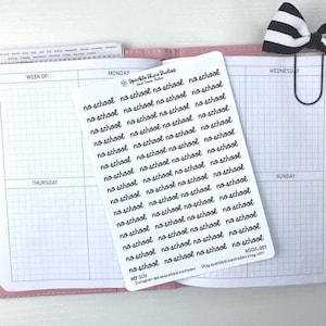 May include: A sheet of white planner stickers with the words "no school" in black cursive script. The stickers are on a pink planner with grid pages. A black and white striped bow paper clip is attached to the planner.