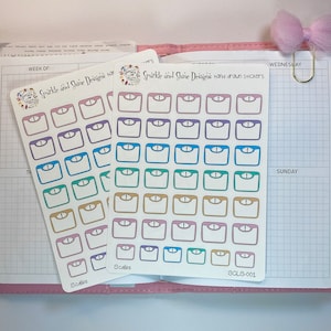 May include: Two sheets of hand-drawn stickers featuring colorful scale designs. Each scale has a white center with a colored border and a small dial. The stickers are in various colors, including purple, blue, green, and gold. The text "Scales" is printed on the bottom.