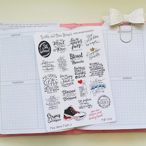 May include: A set of 16 hand-drawn stickers with inspirational quotes and bible verses. The stickers are black and white with red accents. The stickers are on a white background. The stickers are for use in a planner or journal.