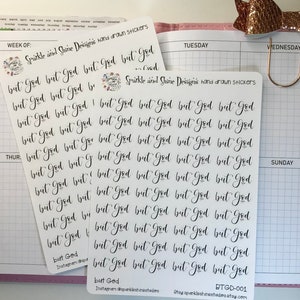 May include: A sheet of white sticker paper with the phrase "But God" repeated multiple times in black cursive handwriting. The stickers are designed for use in a planner or journal.