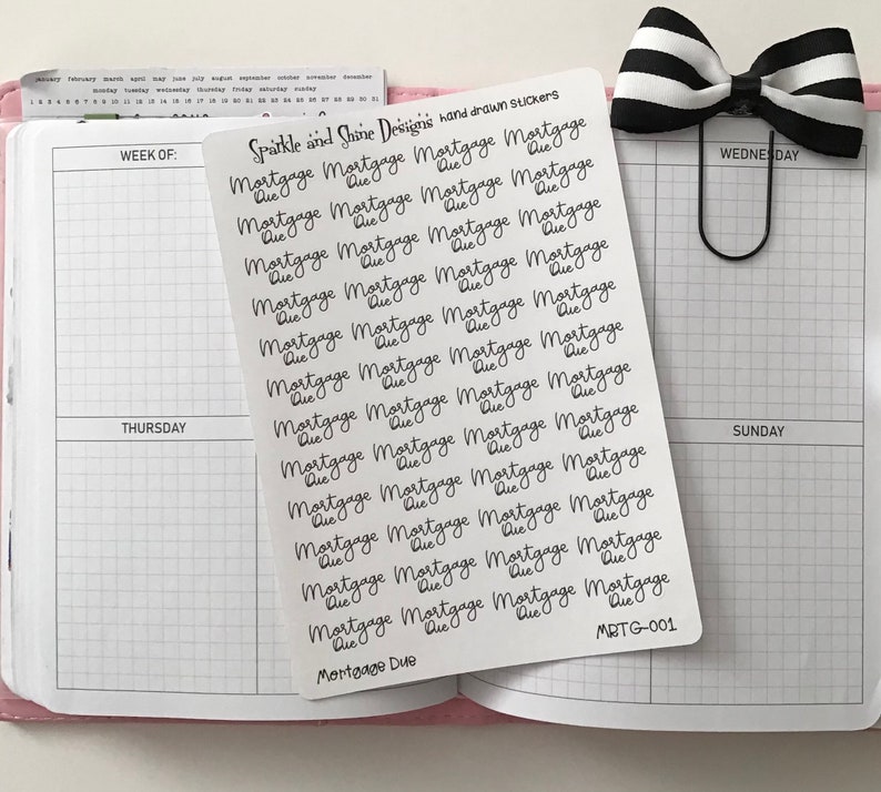 May include: A sheet of stickers with the text "Mortgage Due" repeated multiple times in a handwritten font. The sheet is white with black text and has the text "Sparkle and Shine Designs hand drawn stickers" and "MRTG-001" at the top and bottom.