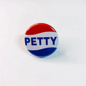 May include: A red, white, and blue button with the word "PETTY" in white letters.