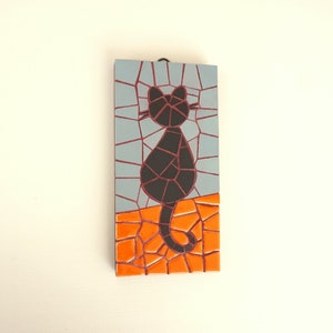Black cat sitting mosaic wall art