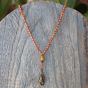 Charming bohemian-inspired necklace features crystal beads and a metal ganesh charm, for a beautiful look, Ganesha pendant necklace