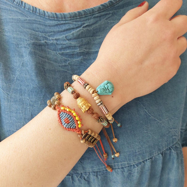 Unique Design Bracelet Adjustable Size Feature Buddha Charm Centerpiece Rudraksha Beads Arrangement Tibetan Style Elements Handmade Spiritual Jewelry Women Fashion Accessory Boho Collection Piece Meditation Practice Aid Daily Wear Option
