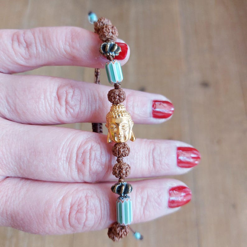 Handmade Beaded Bracelet Buddha Charm Design Rudraksha Beads Combination Tibetan Style Elements Spiritual Jewelry Collection Women Fashion Accessory Boho Inspired Look Meditation Practice Aid Adjustable Size Comfort Unique Gift Idea Natural