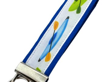 Personalized Kayak Keychain: Fabric Key Fob with Optional Initial Charms on Blue Background
